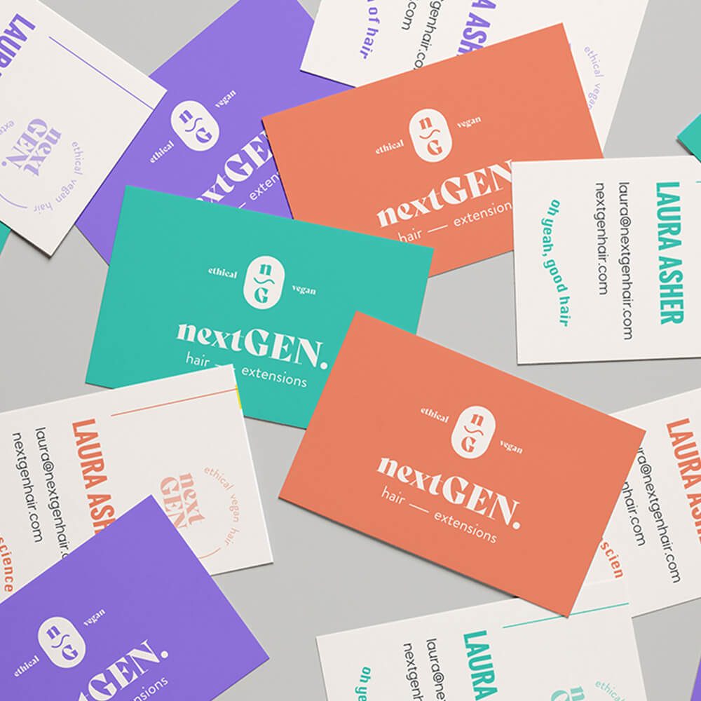 business cards for next gen hair featuring the logo on block colour