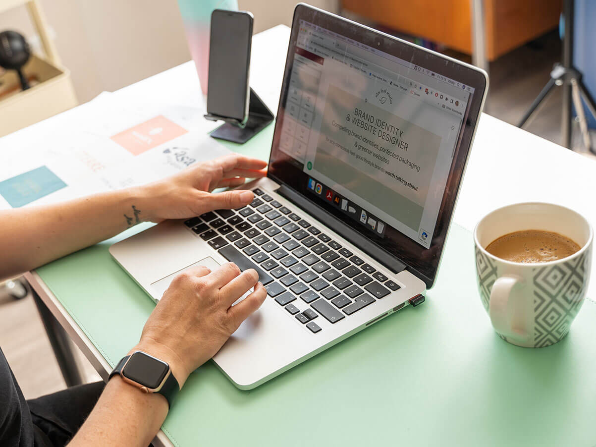 Website designer working on laptop